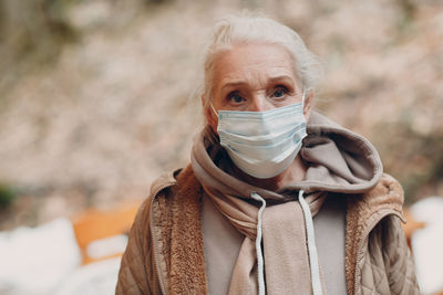 Portrait of woman with ice cream in winter