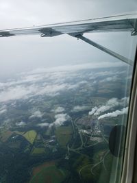 Aerial view of landscape seen through airplane window