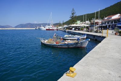 Boats moored at harbor