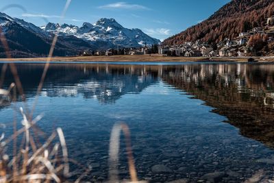 Scenic view of town by lake silvaplana