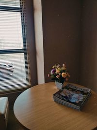 Flower vase on table at home