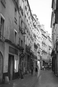 People walking on street in city