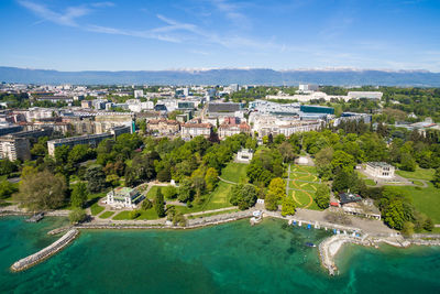 High angle view of buildings and trees against sky