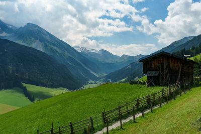 Scenic view of landscape and mountains against sky