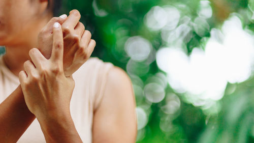 Close-up of hands against blurred background