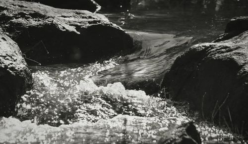 Close-up of sea by rocks