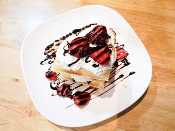 High angle view of cake in plate on table