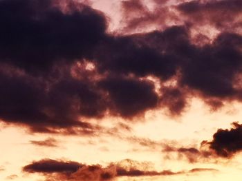 Low angle view of clouds in sky during sunset