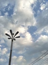 Low angle view of street light against sky