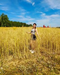 Full length of man standing on field against sky