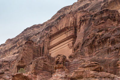 Low angle view of rock formations against sky