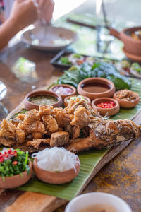 Cropped image of man preparing food on table