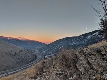 Scenic view of snowcapped mountains against clear sky