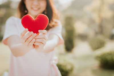 Close-up of hands holding heart shape