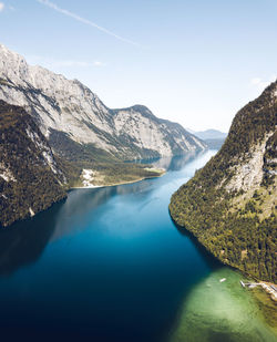 Scenic view of lake and mountains against sky