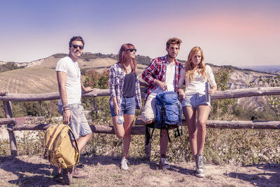 Group of young hikers in the mountains preparing an excursion