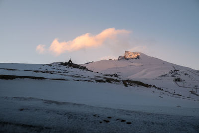 Scenic view of mountains against sky during winter