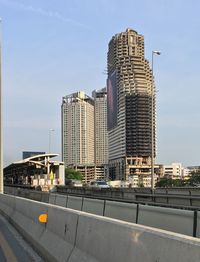 Modern buildings against sky in city