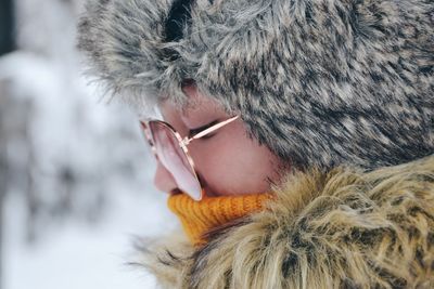 Close-up portrait of woman wearing hat