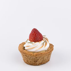 Close-up of cake against white background