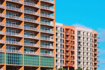 Low angle view of buildings against blue sky