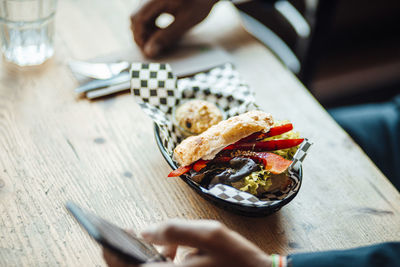 High angle view of person preparing food on table