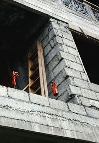 Low angle view of rubber gloves on metal rod at construction site