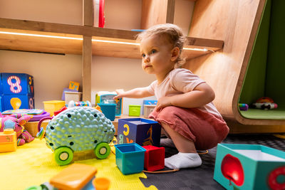 Boy playing with toy blocks
