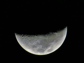 Low angle view of moon in sky at night