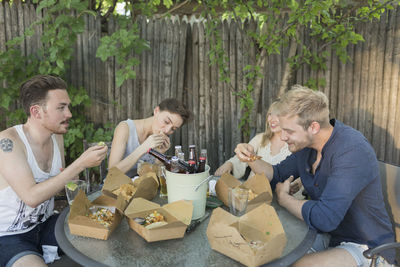 Friends eating at a party