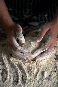 Midsection of person preparing food