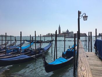 Boats moored in canal