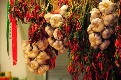 Strings of chili pepper and garlic on sale.