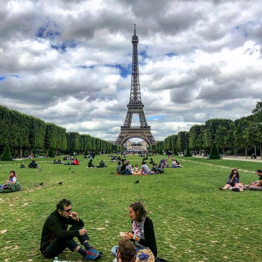 architecture, travel destinations, tourism, built structure, tower, real people, sky, travel, women, plant, city, group of people, nature, the past, history, cloud - sky, grass, tree, tourist, tall - high, outdoors