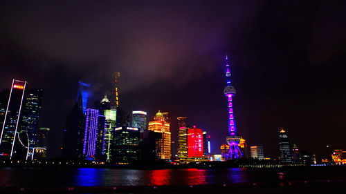 Low angle view of illuminated city at night