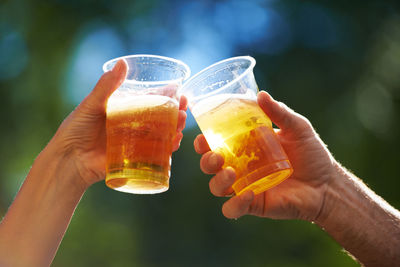 Close-up of hand holding drink