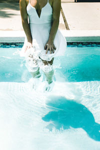 Low section of man in swimming pool