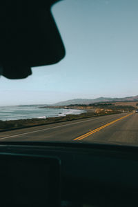 Road seen through car windshield