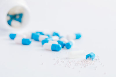 Close-up of pills on white background