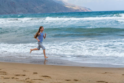 Full length of boy on beach