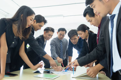 Business colleagues working at office