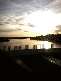 Pier on sea at sunset