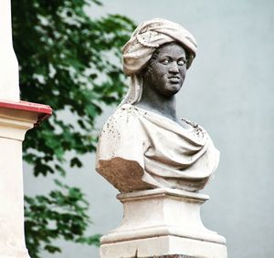 Low angle view of statue against trees