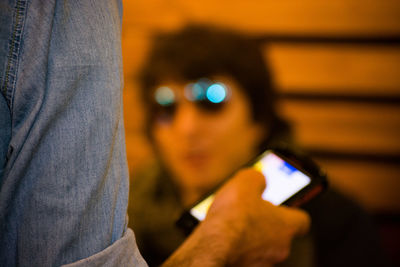 Close-up of man using mobile phone