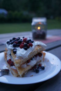 Close-up of pie slices served in plate on table at yard