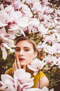 Portrait of woman with pink flowers