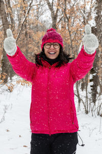 Portrait of a smiling woman in snow