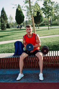 Side view of man exercising in gym