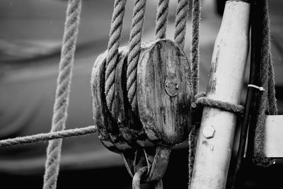 Close-up of rope tied on pulley of nautical vessel