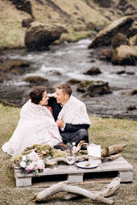 Couple sitting on floor